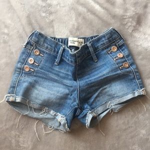 Jean shorts with rips at the bottom